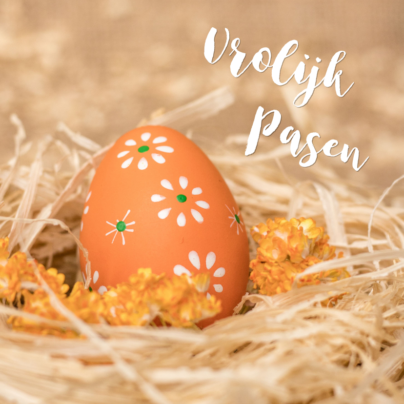 Paaskaarten - Paaskaart met een oranje paasei in een nestje met bloemen